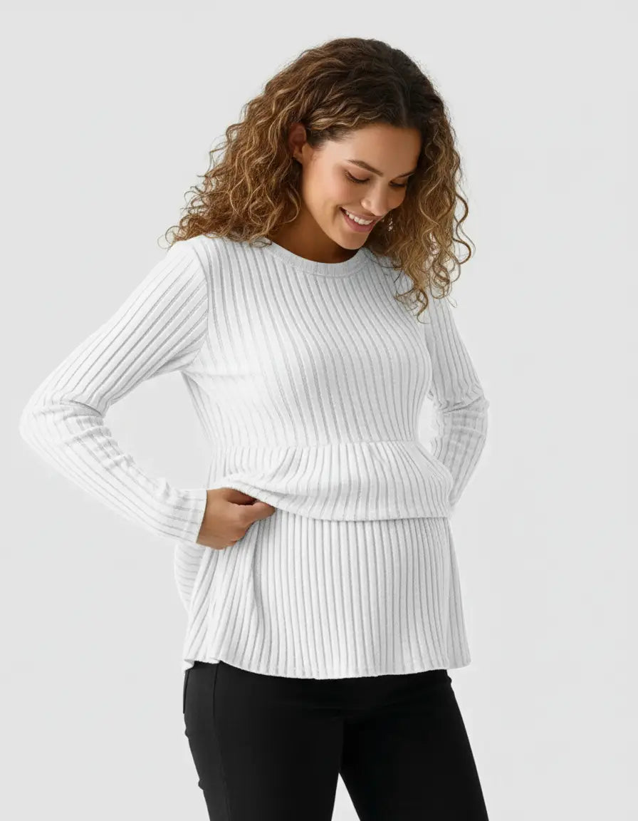 Smiling pregnant woman in a white stretch-ribbed casual-fit maternity top with long sleeves.