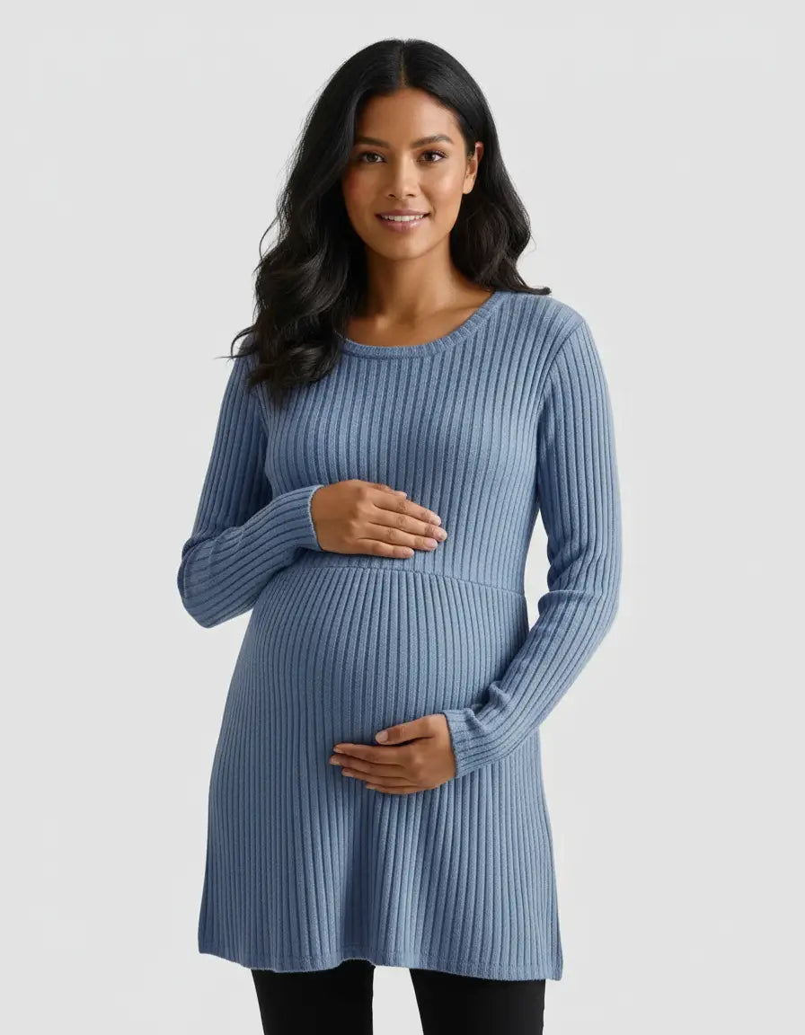 Smiling pregnant woman in a blue stretch-ribbed casual-fit maternity top with long sleeves.