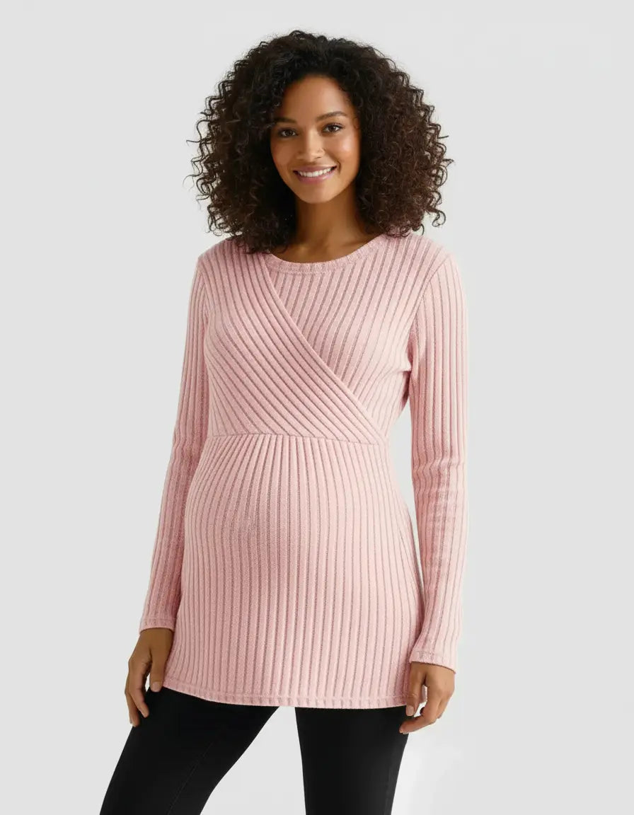 Smiling pregnant woman in a pink stretch-ribbed casual-fit maternity top with a crossover design.