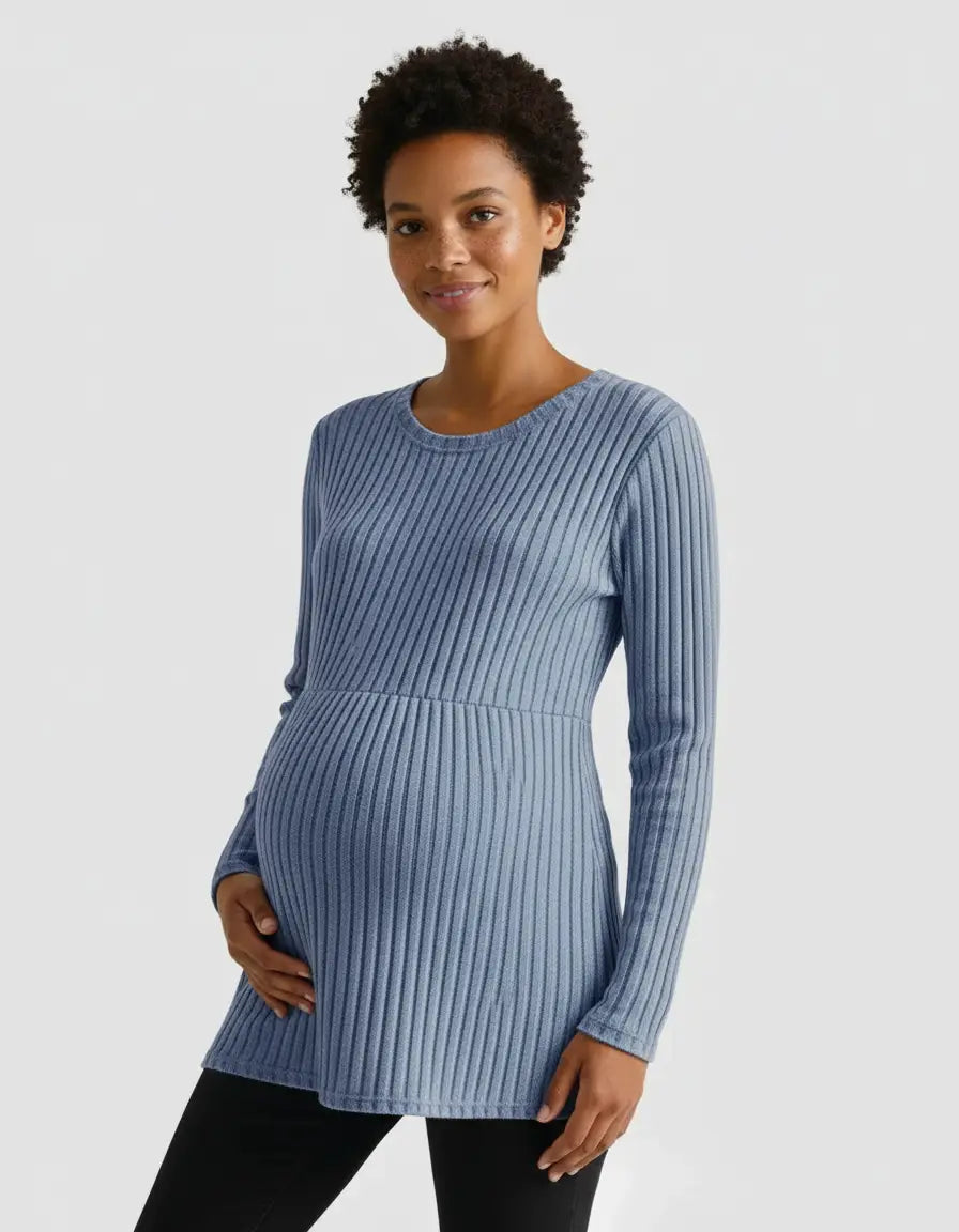 Smiling pregnant woman in a blue stretch-ribbed long-sleeve maternity top.