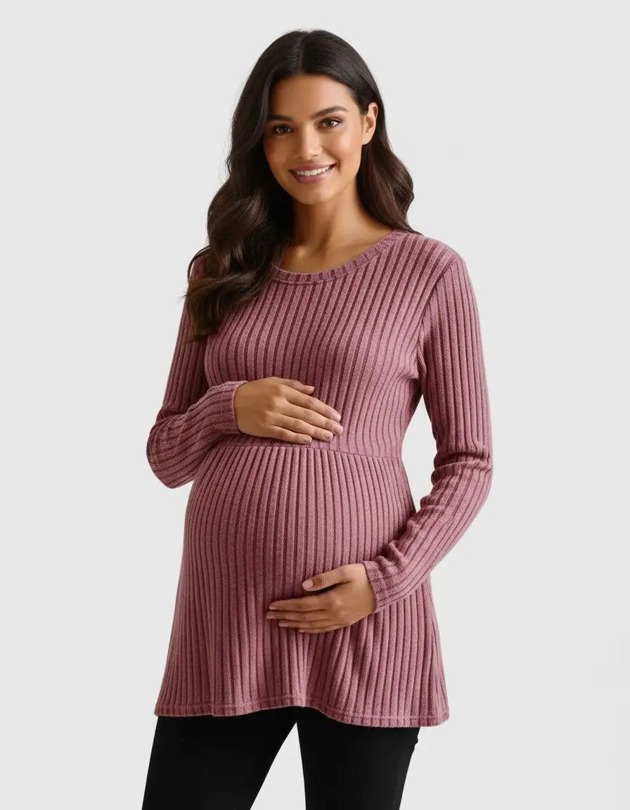 Smiling pregnant woman in a pink stretch-ribbed casual-fit maternity top.