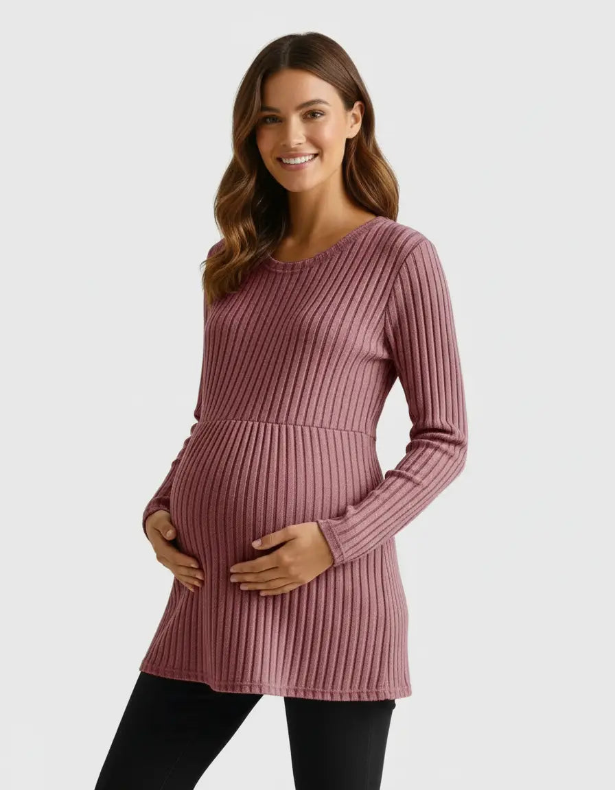 Smiling pregnant woman in a pink stretch-ribbed casual-fit maternity top, hands on belly.