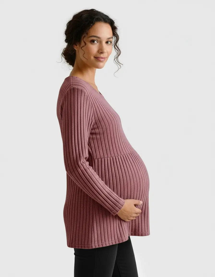 Pregnant woman in a mauve stretch-ribbed casual-fit maternity top with long sleeves.