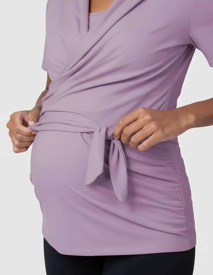 Lavender 3-in-1 skin-to-skin nursing wrap top with a tie waist on a pregnant woman.
