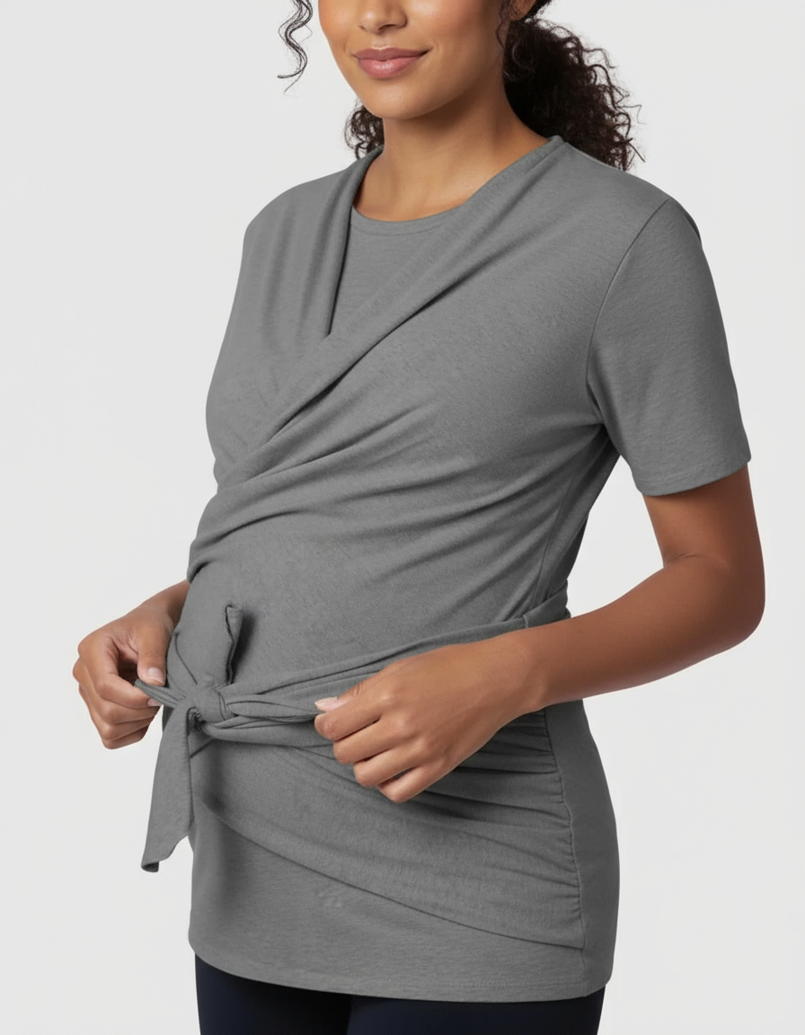 Pregnant woman in a gray 3-in-1 skin-to-skin nursing wrap top with a tie-front detail.