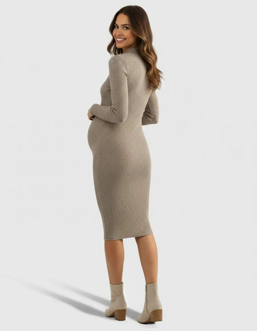 Smiling pregnant woman in a taupe ribbed knit wrap nursing midi dress and cream ankle boots.