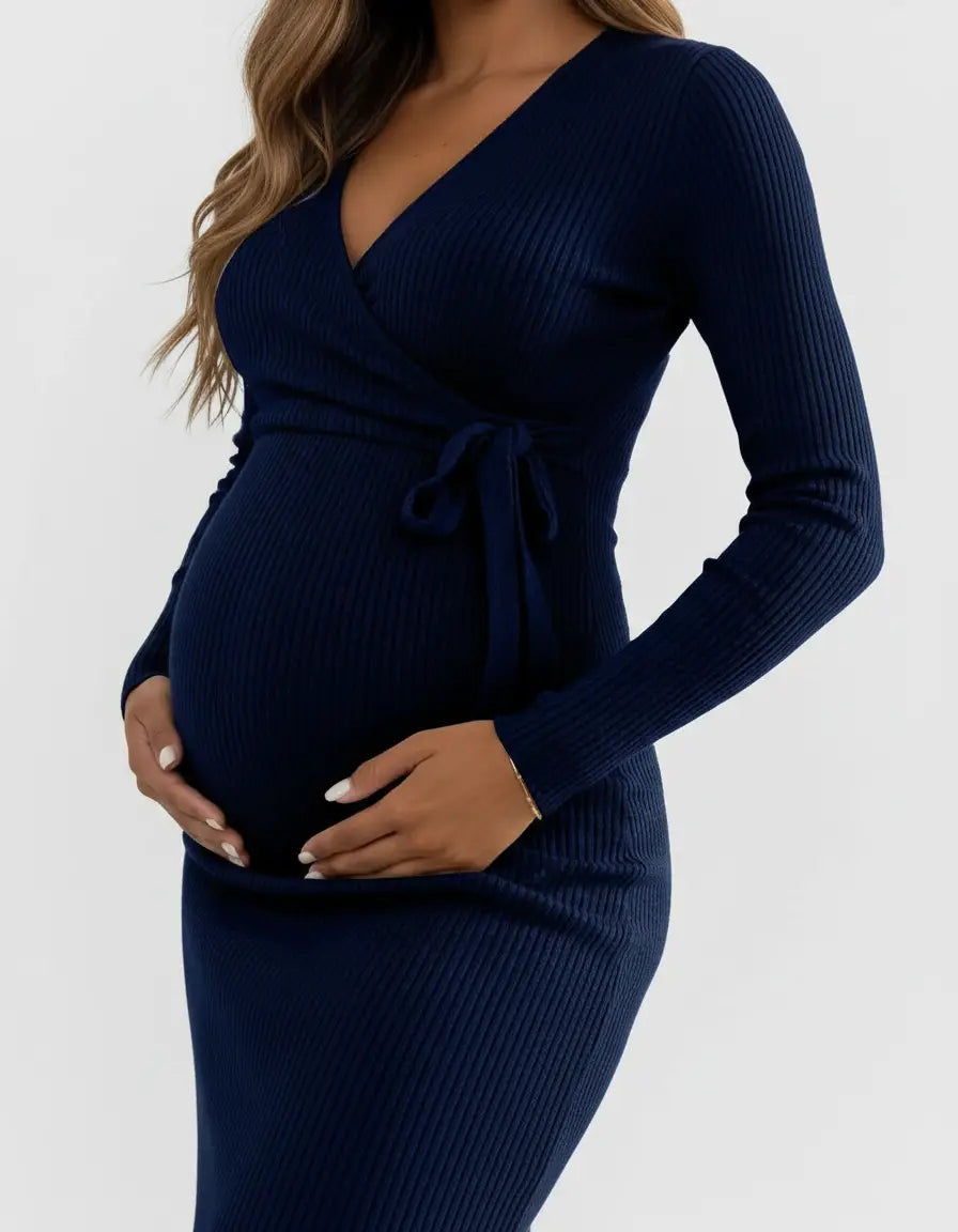 Navy ribbed knit wrap midi dress with long sleeves, tied at the waist, worn by a pregnant woman.