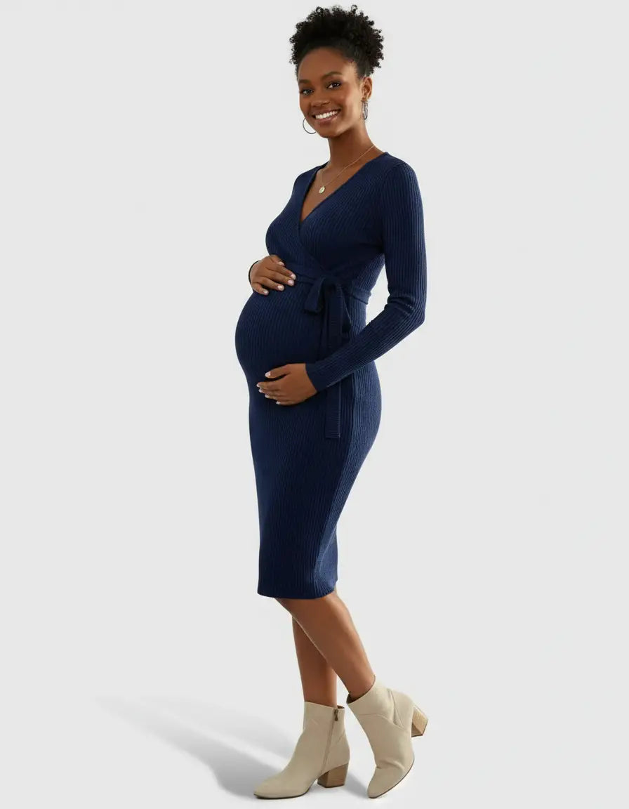 Smiling pregnant woman in a navy ribbed knit wrap midi dress with tie waist and long sleeves.
