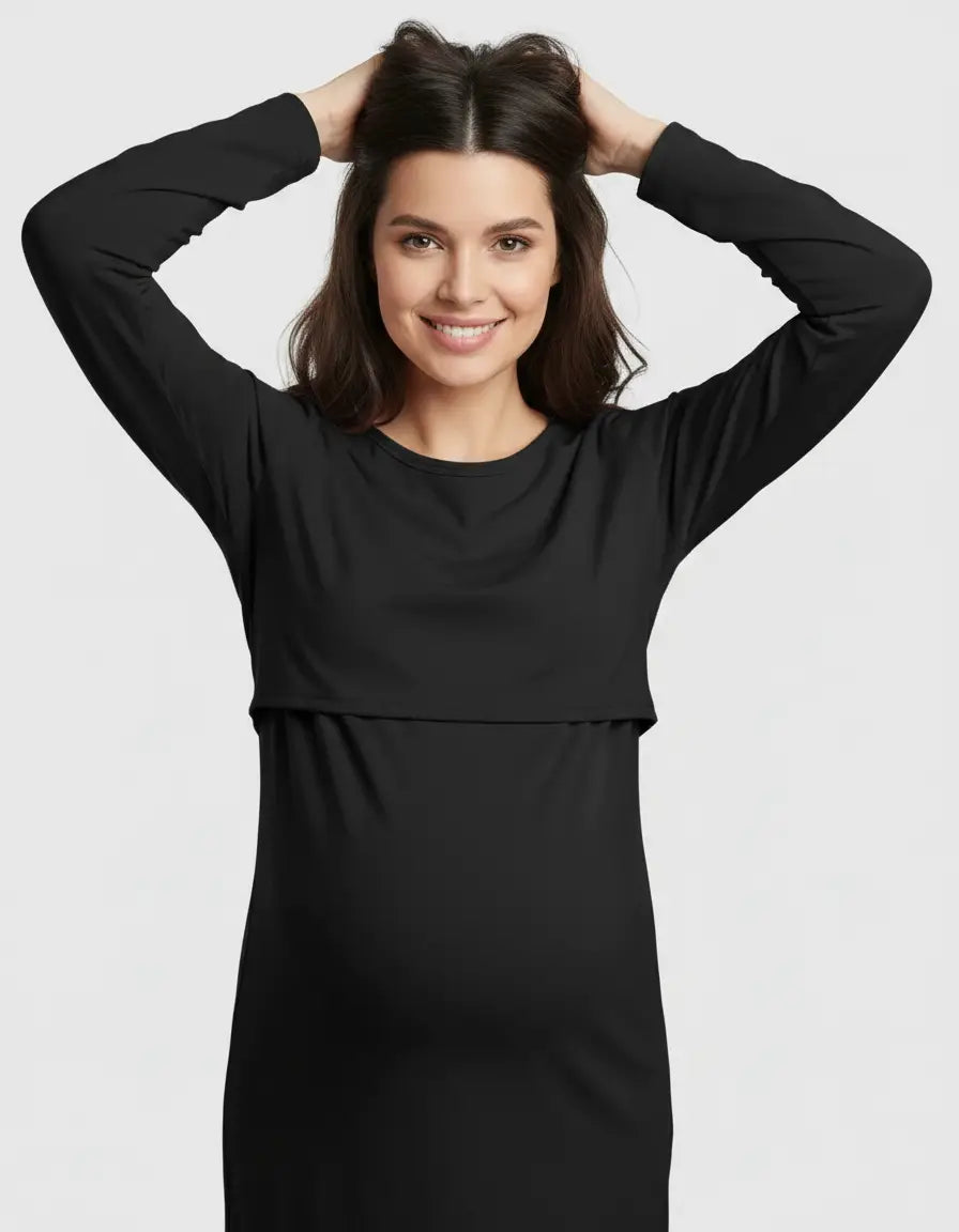 Smiling pregnant woman in a black long-sleeve round neck nursing top with feeding port.