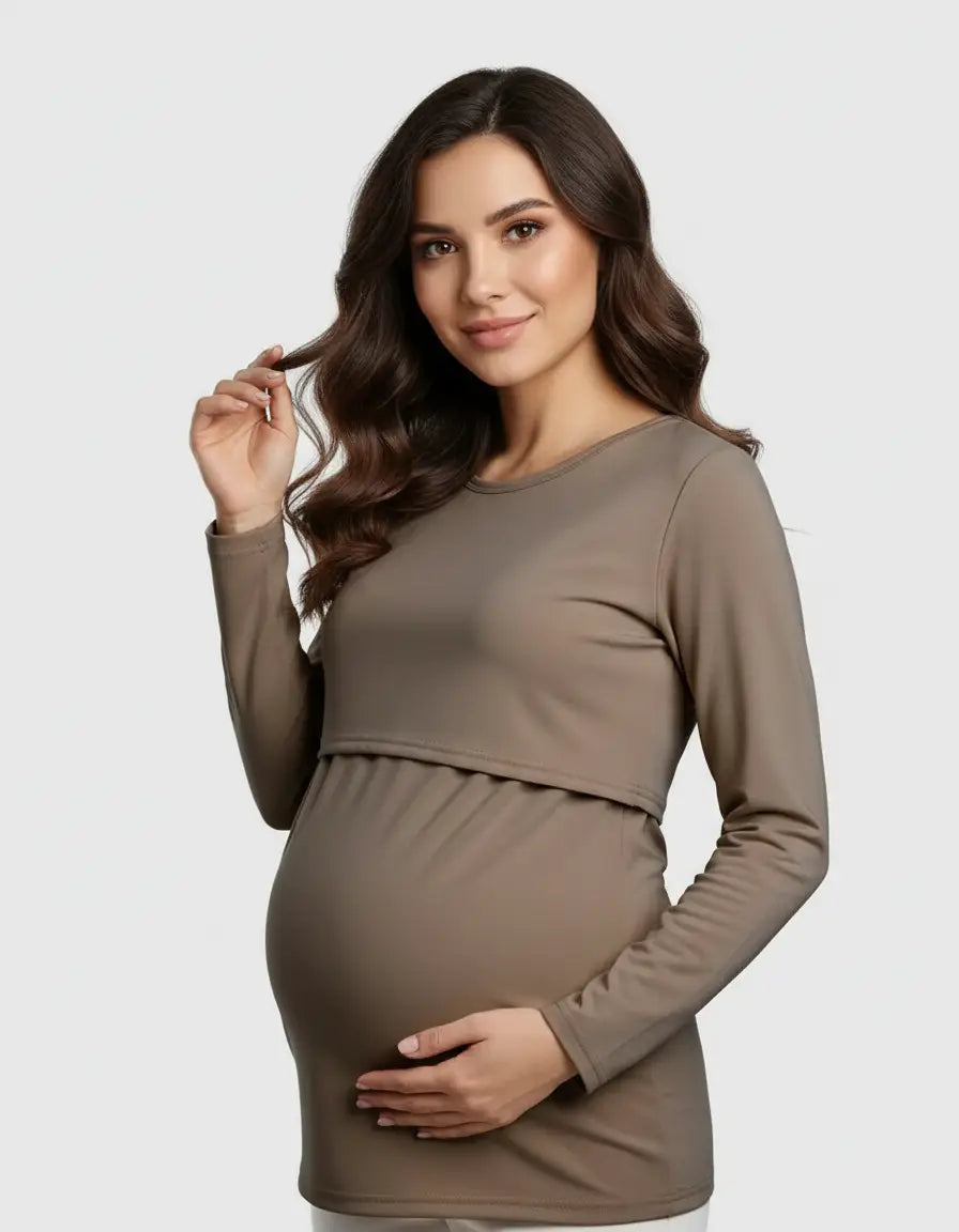 Smiling pregnant woman modeling a long-sleeved, round neck, taupe nursing top with a feeding port.