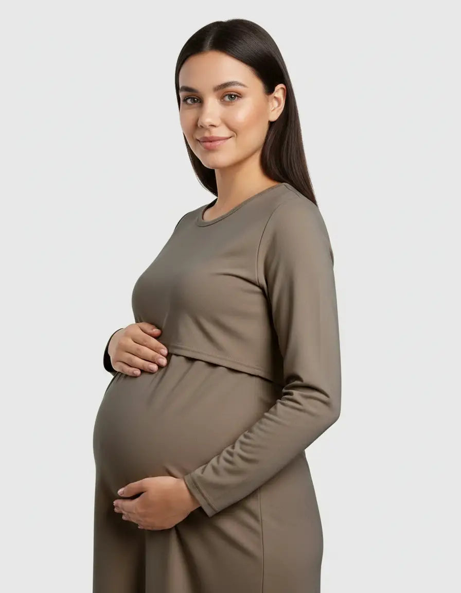 Pregnant woman in a long-sleeved, olive green round neck nursing top with feeding port.