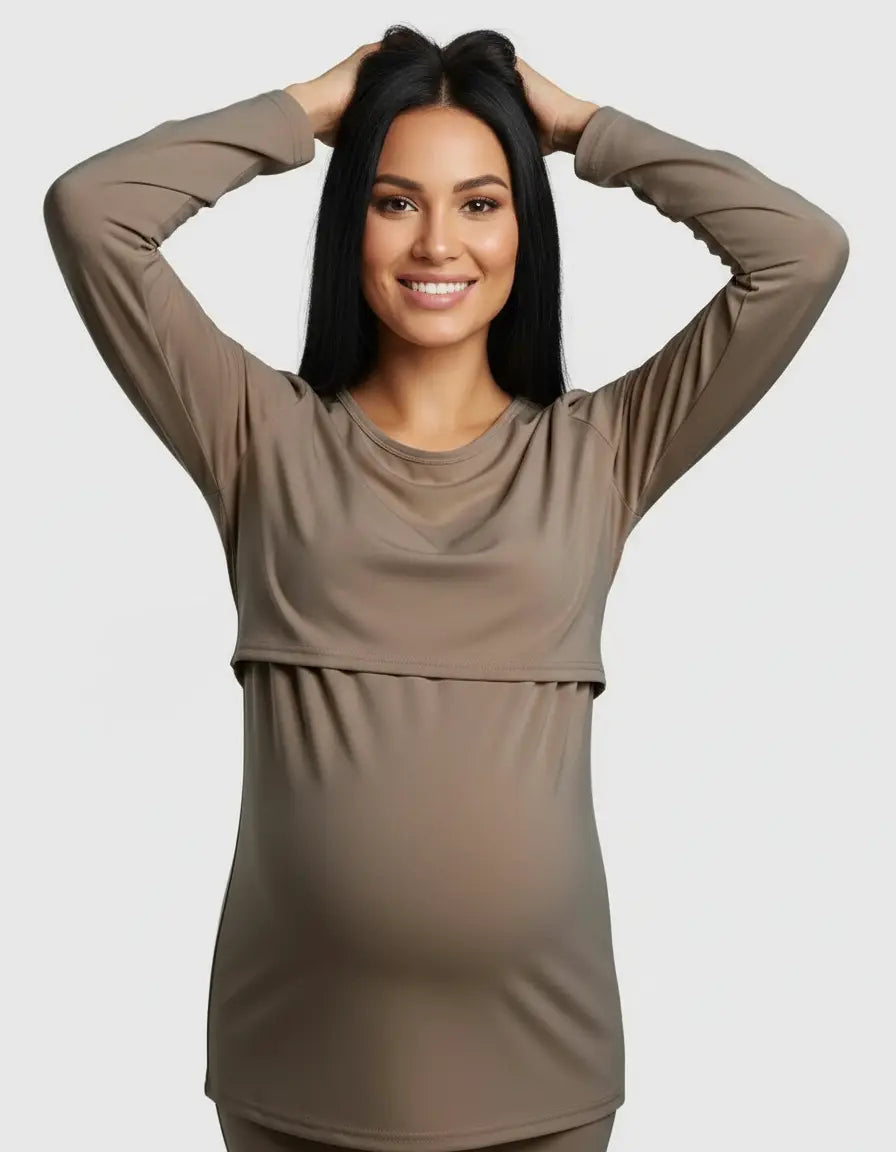Smiling pregnant woman in a taupe long-sleeve round neck nursing top with feeding port.