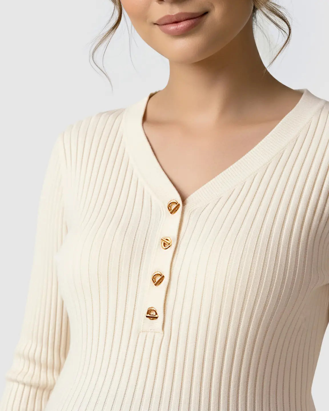 Cream ribbed V-neck maternity nursing sweater with gold metal buttons.