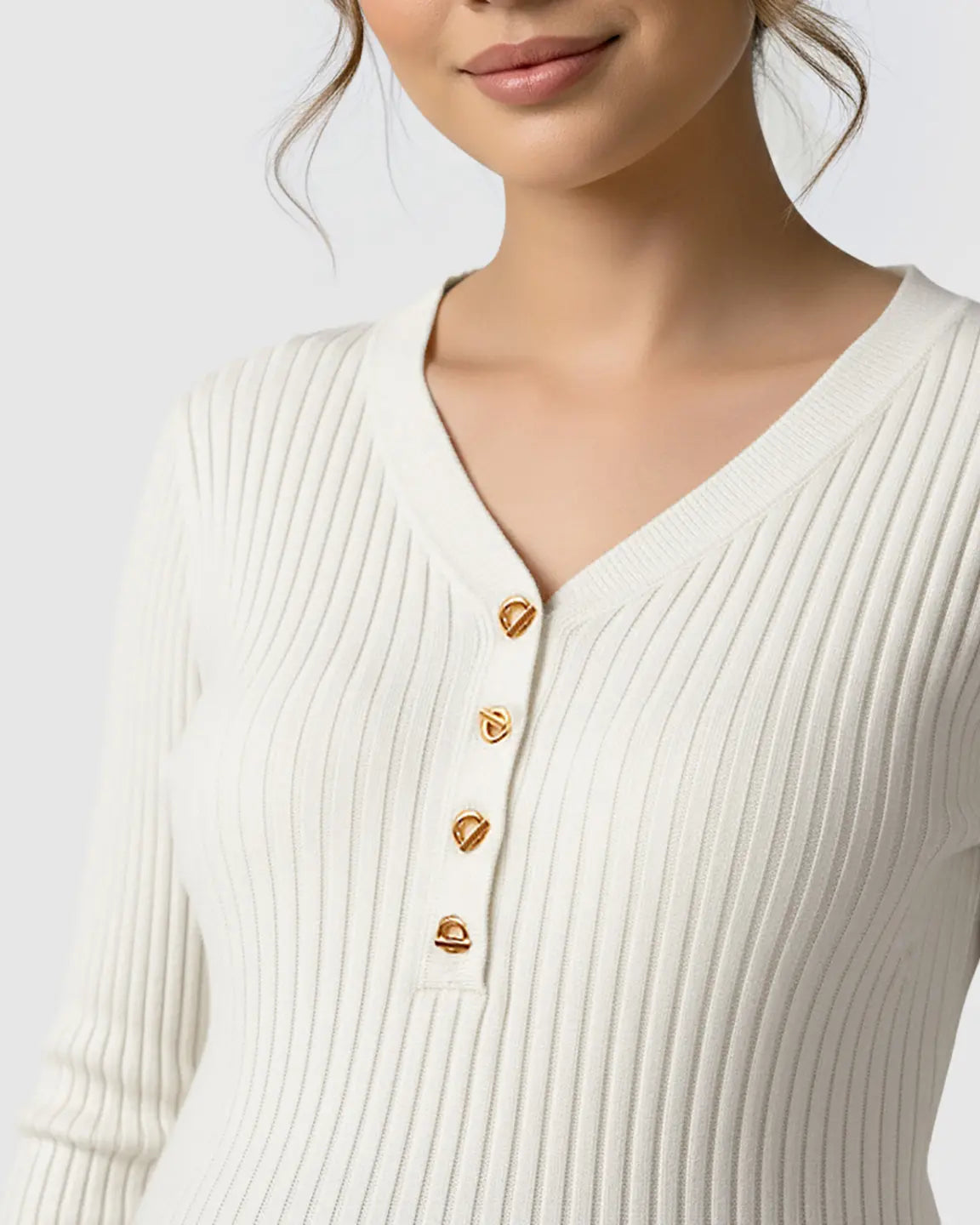 White ribbed V-neck maternity nursing sweater with gold button details.