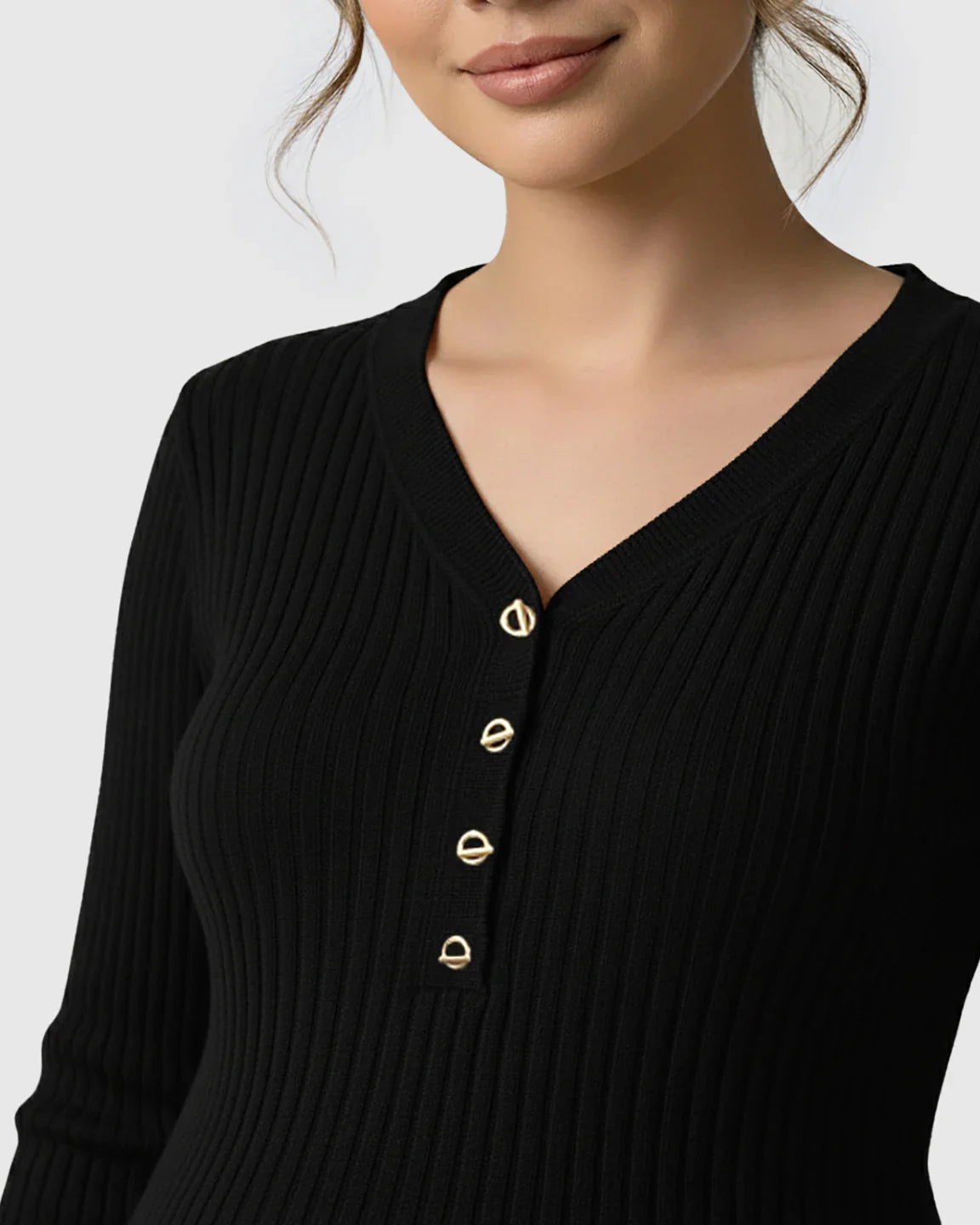 Black ribbed V-neck maternity nursing sweater with gold metal buttons, close-up.