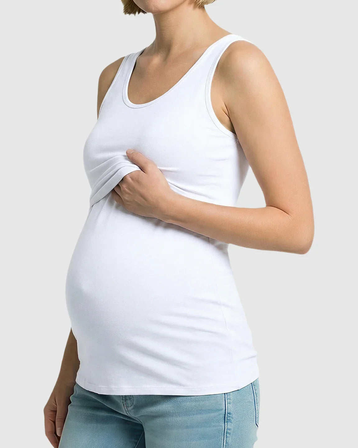 White stretch maternity tank top with nursing access, worn by a pregnant woman.
