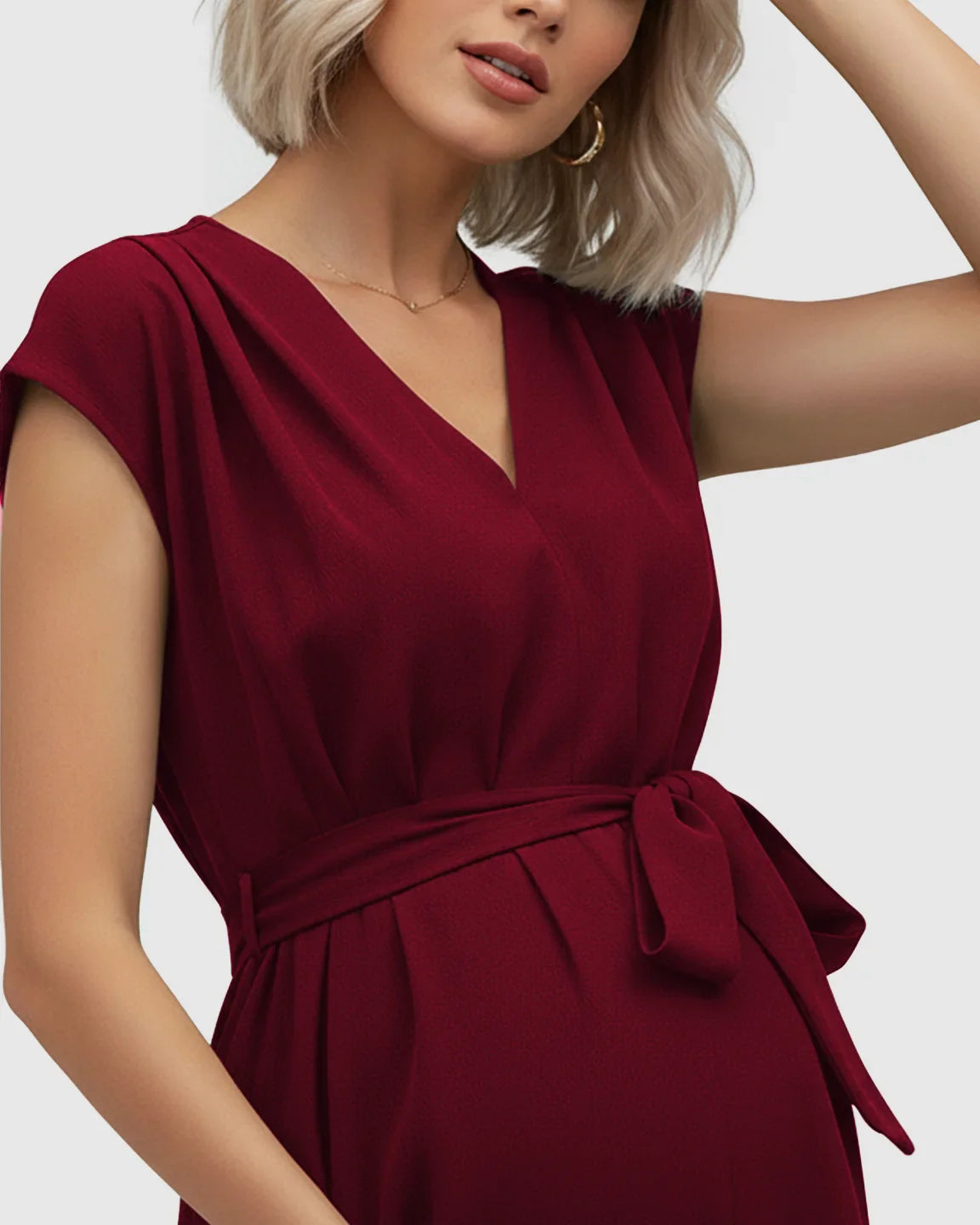 Maternity midi dress in deep red with a V-neck, flutter sleeves, and adjustable tie-waist.