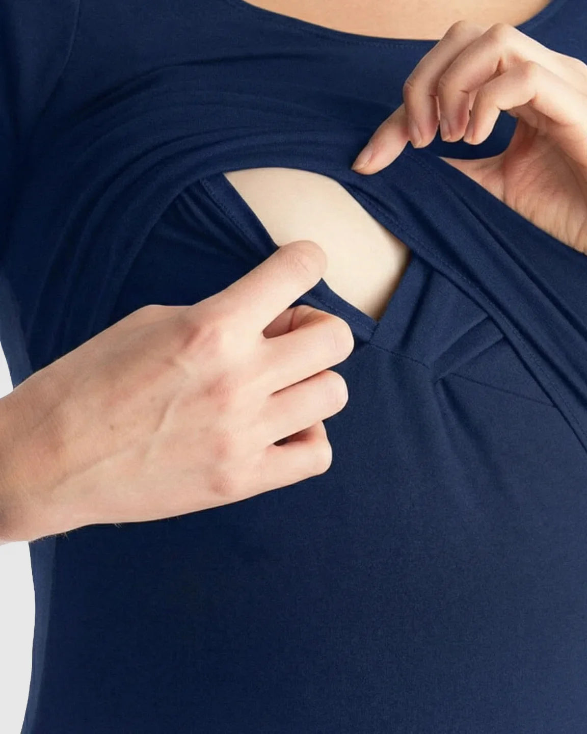 Woman demonstrating easy nursing access of a navy stretch-fit V-neck nursing t-shirt.