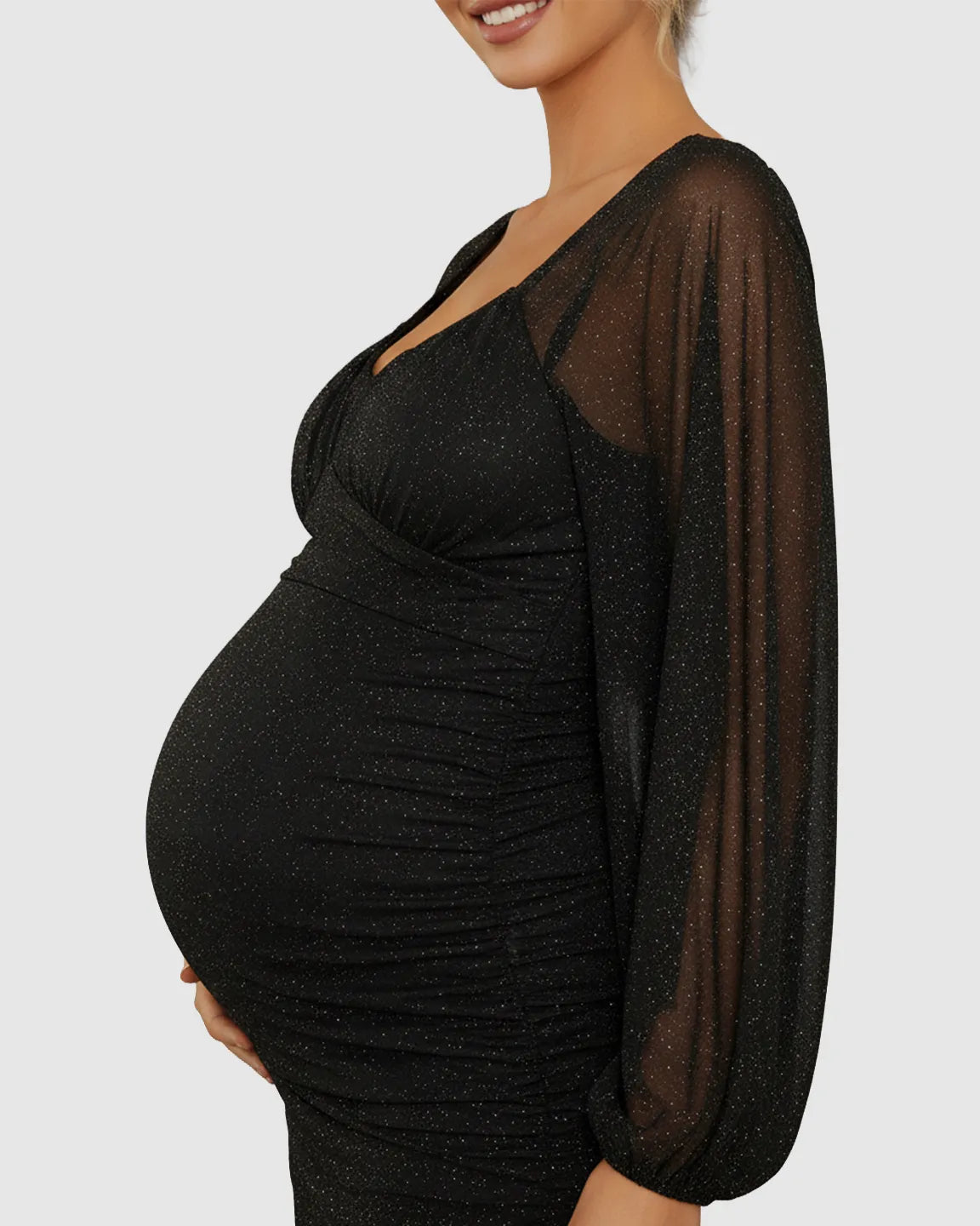 Black sparkle mesh maternity short dress with deep V-neck, sheer balloon sleeves, and ruched silhouette.