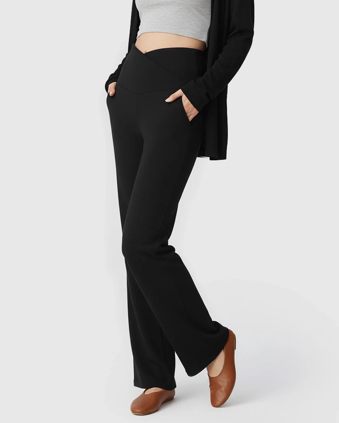 Black wide-leg maternity lounge pants with a crossover waist, side pockets, and relaxed fit.