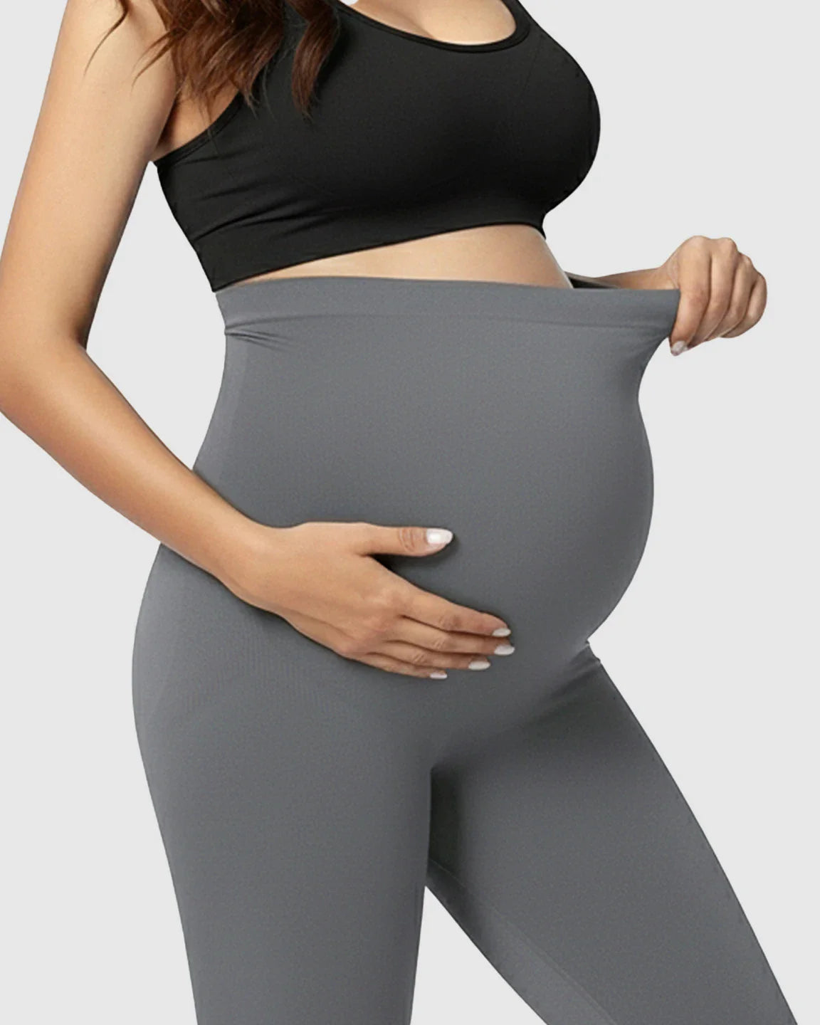 Pregnant woman in gray Bump Society Belly Support Stretch Maternity Leggings with high waist panel.