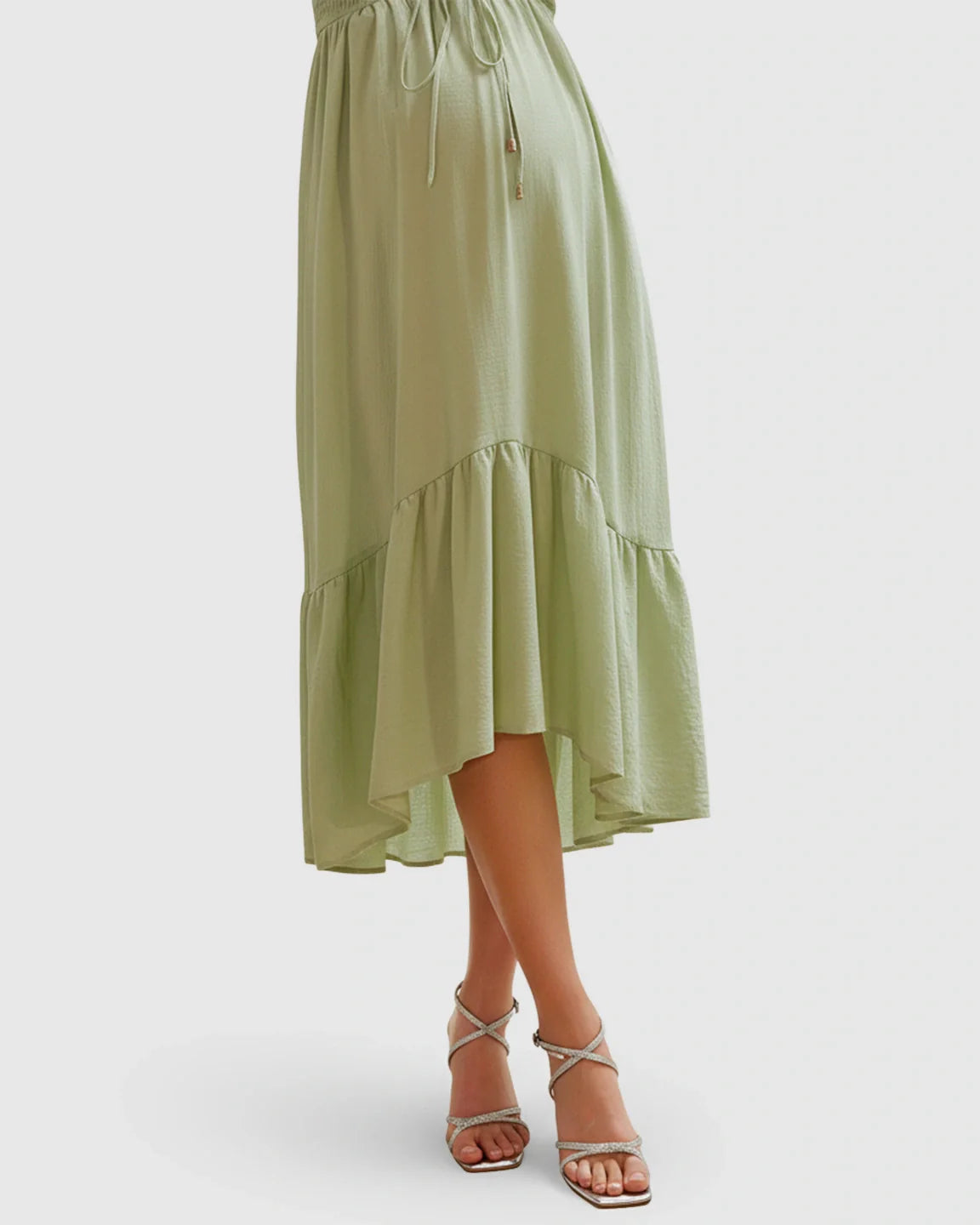 Flowy midi maternity dress in light green polyester with smocked bodice, drawstring, and ruffled hem.