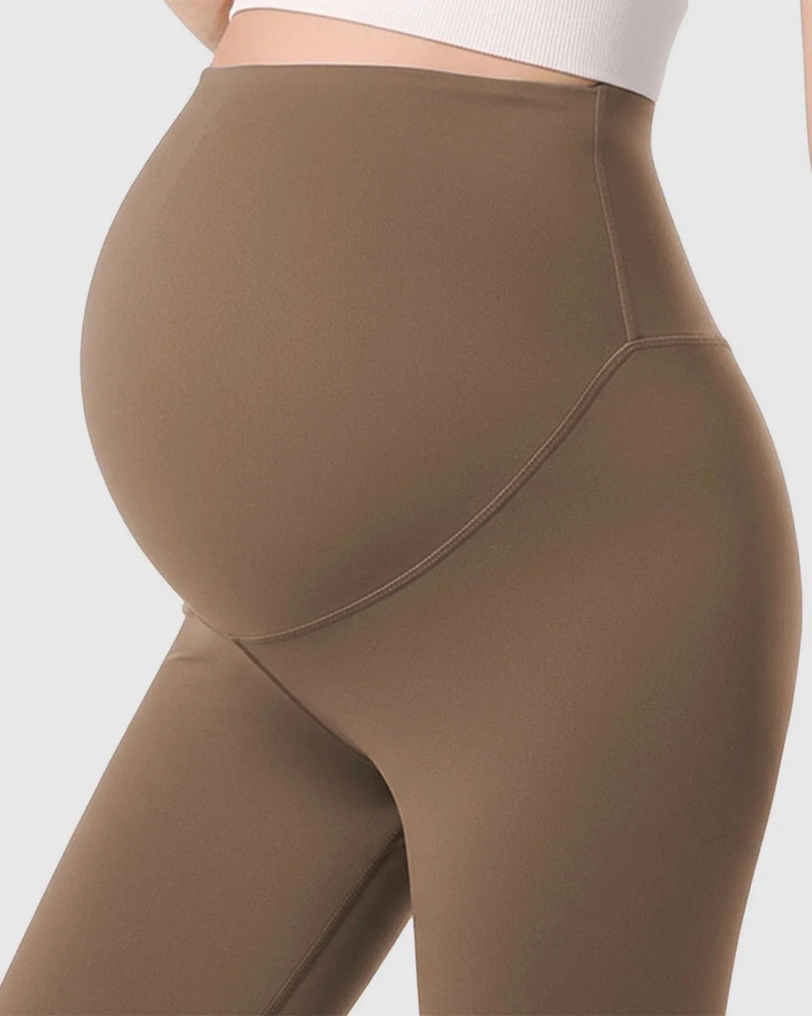 Maternity leggings in a warm brown, featuring a double-layer belly support panel for comfort and gentle structure.