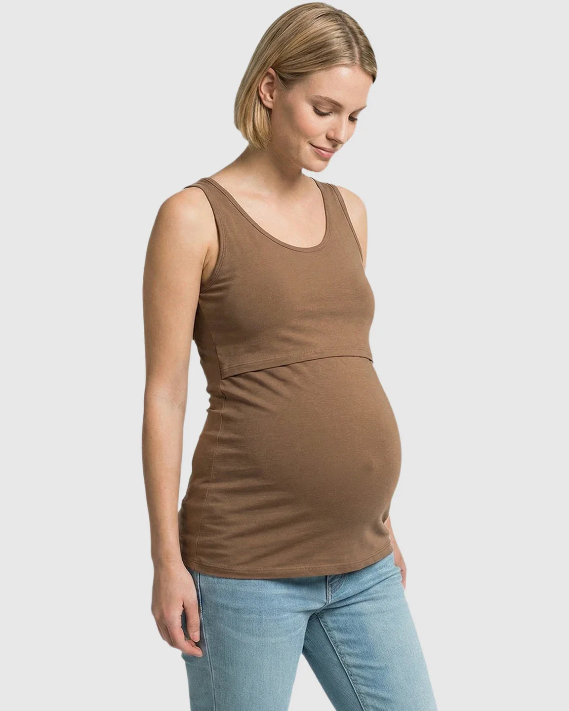 Pregnant woman in a brown stretch nursing-access maternity tank top and jeans.
