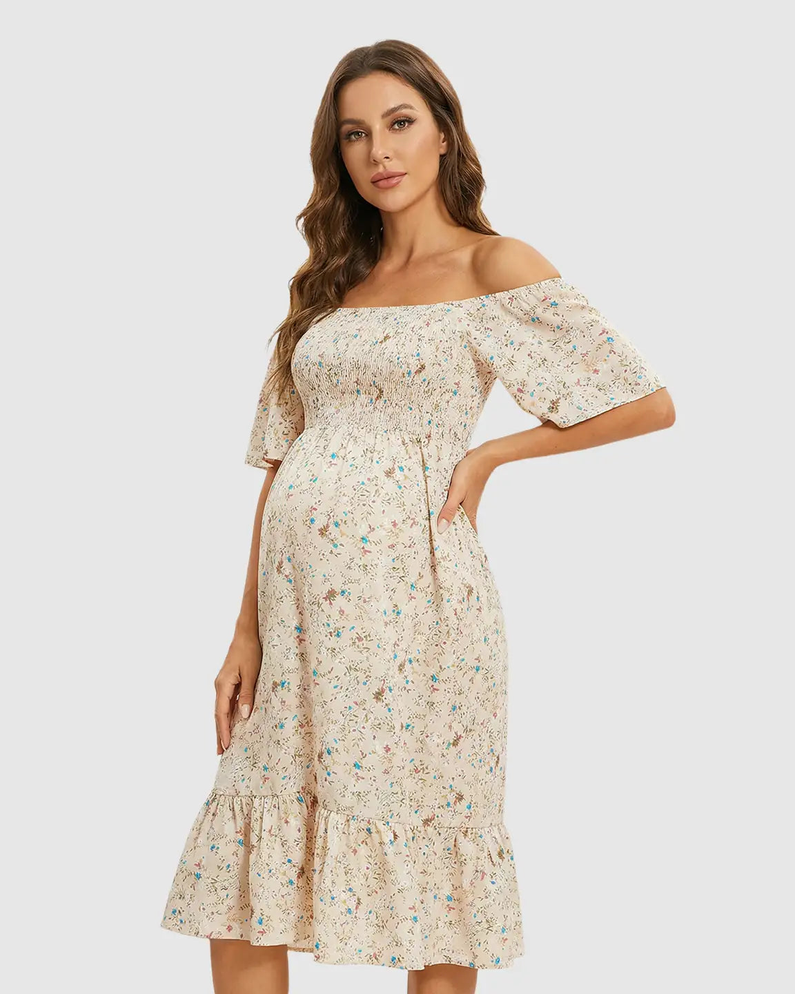 Beige floral flutter-sleeve smocked maternity midi dress with tiered skirt.