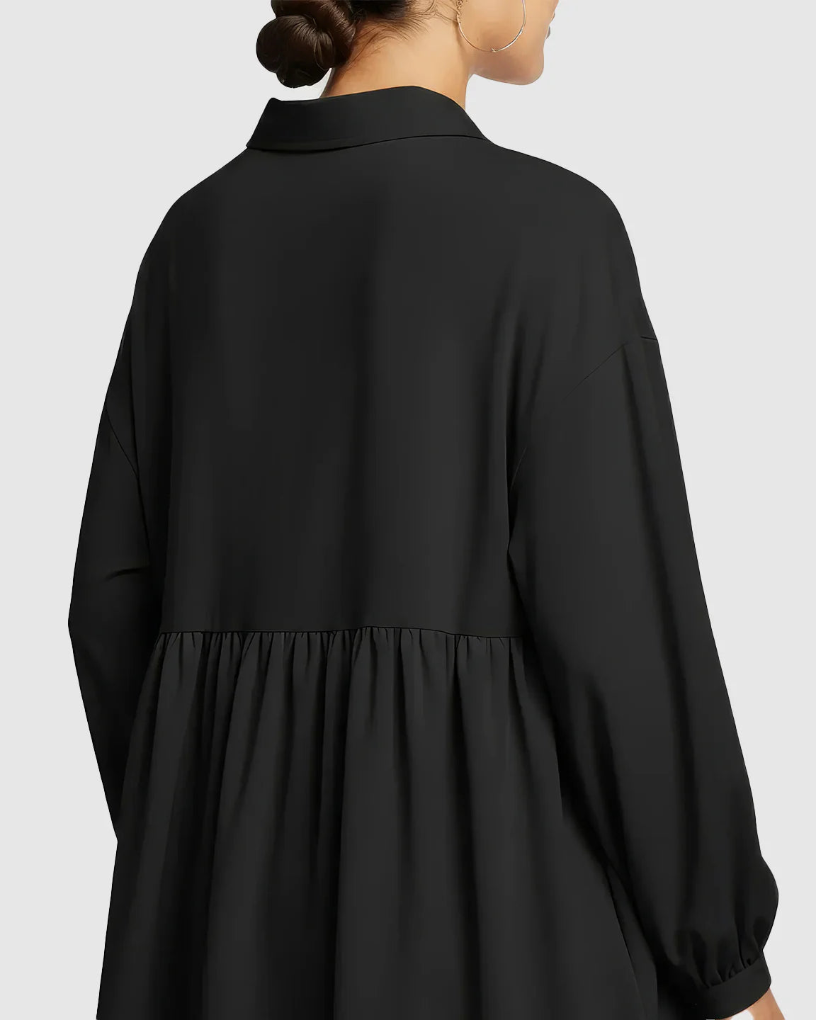 Black chiffon maternity shirt with lapel collar, long sleeves, and loose babydoll fit, viewed from the back.