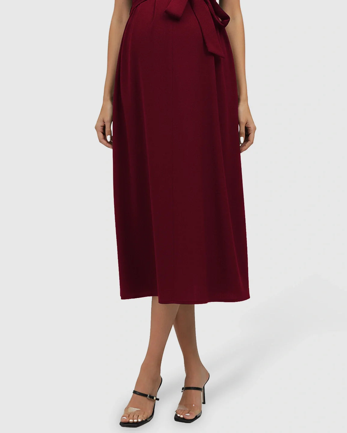 Burgundy tie-waist V-neck maternity midi dress with flutter sleeves, flowing over the bump.