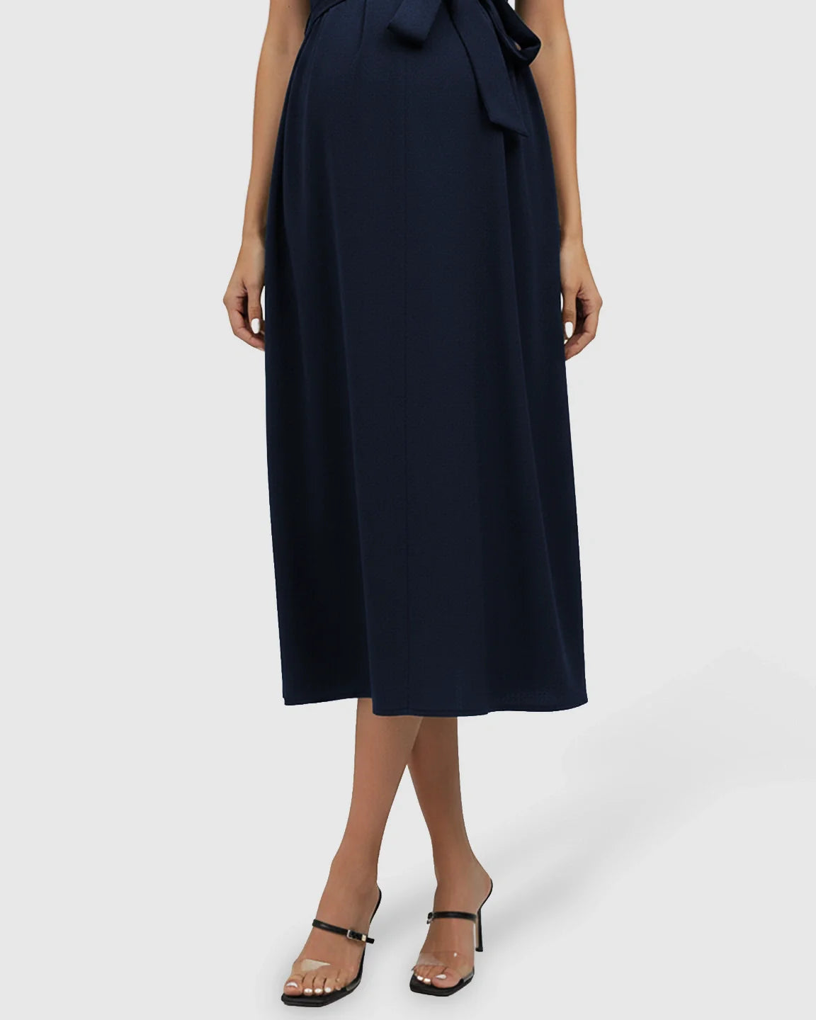 Navy tie-waist V-neck maternity midi dress, flowing comfortably over the bump.