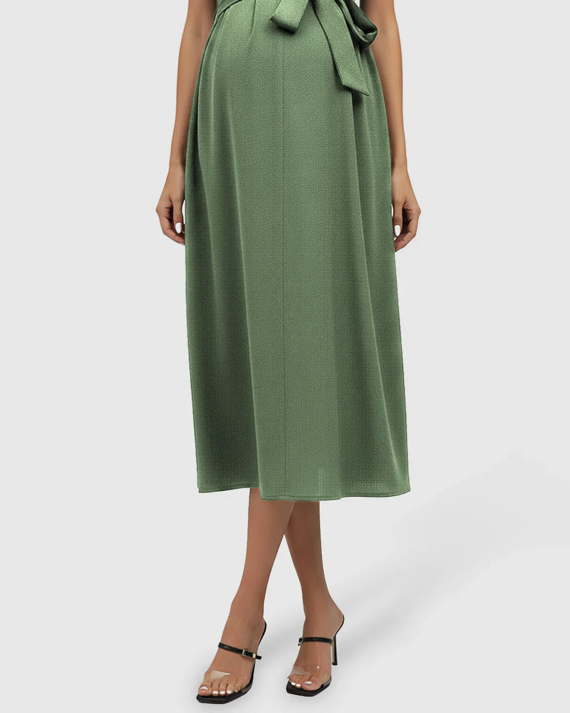 Green tie-waist V-neck maternity midi dress with flutter sleeves, flowing over a pregnant belly.