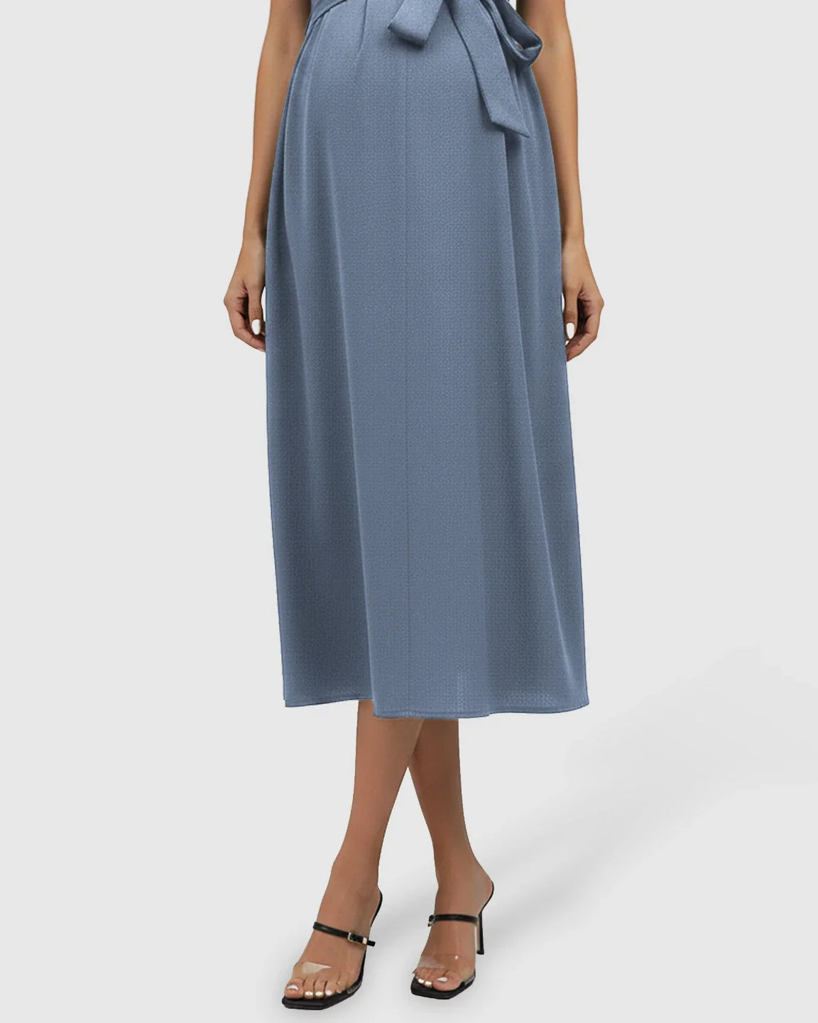 Blue tie-waist V-neck maternity midi dress with flutter sleeves, flowing over a pregnant belly.
