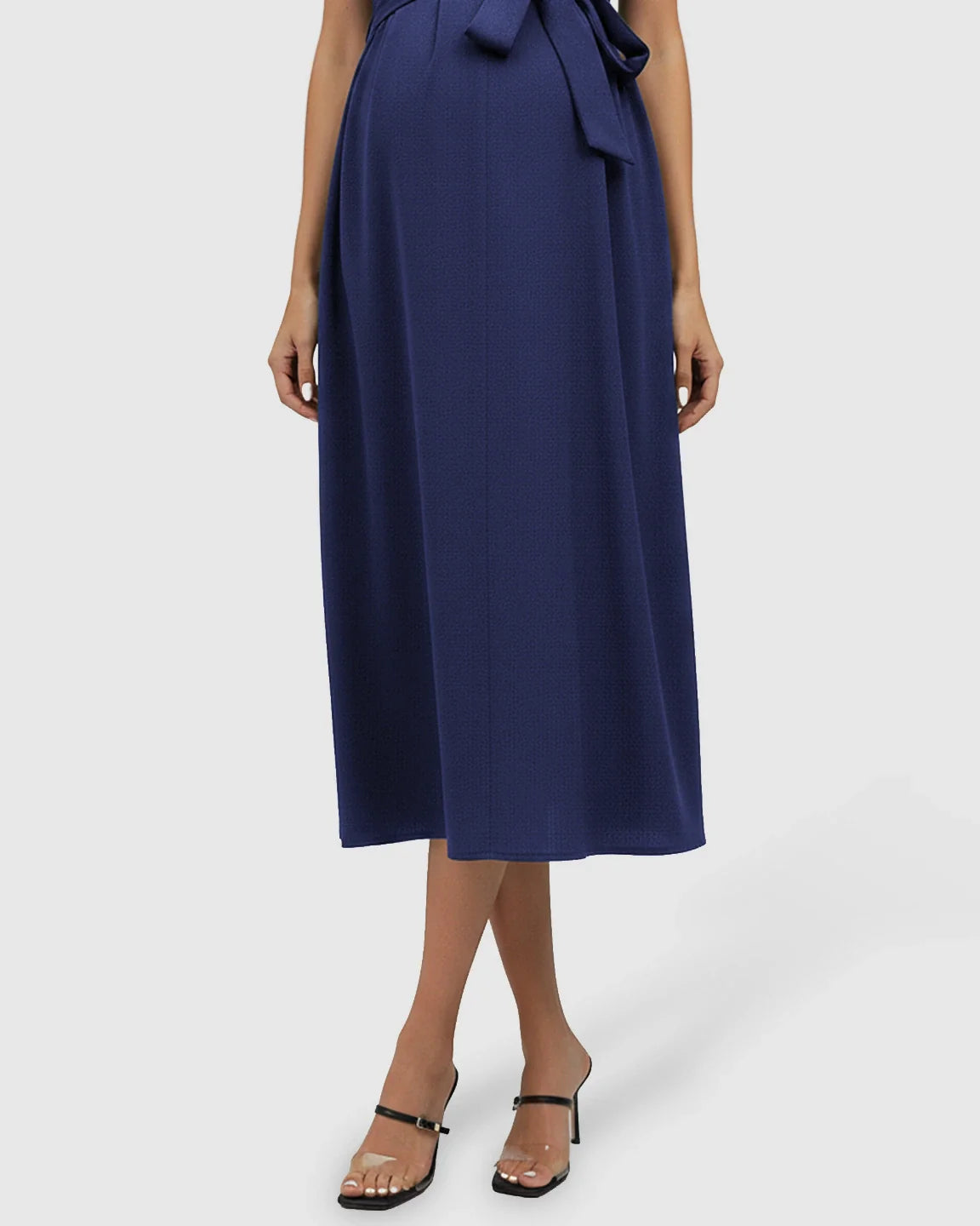 Navy blue tie-waist V-neck maternity midi dress with flutter sleeves, flowing over the bump.