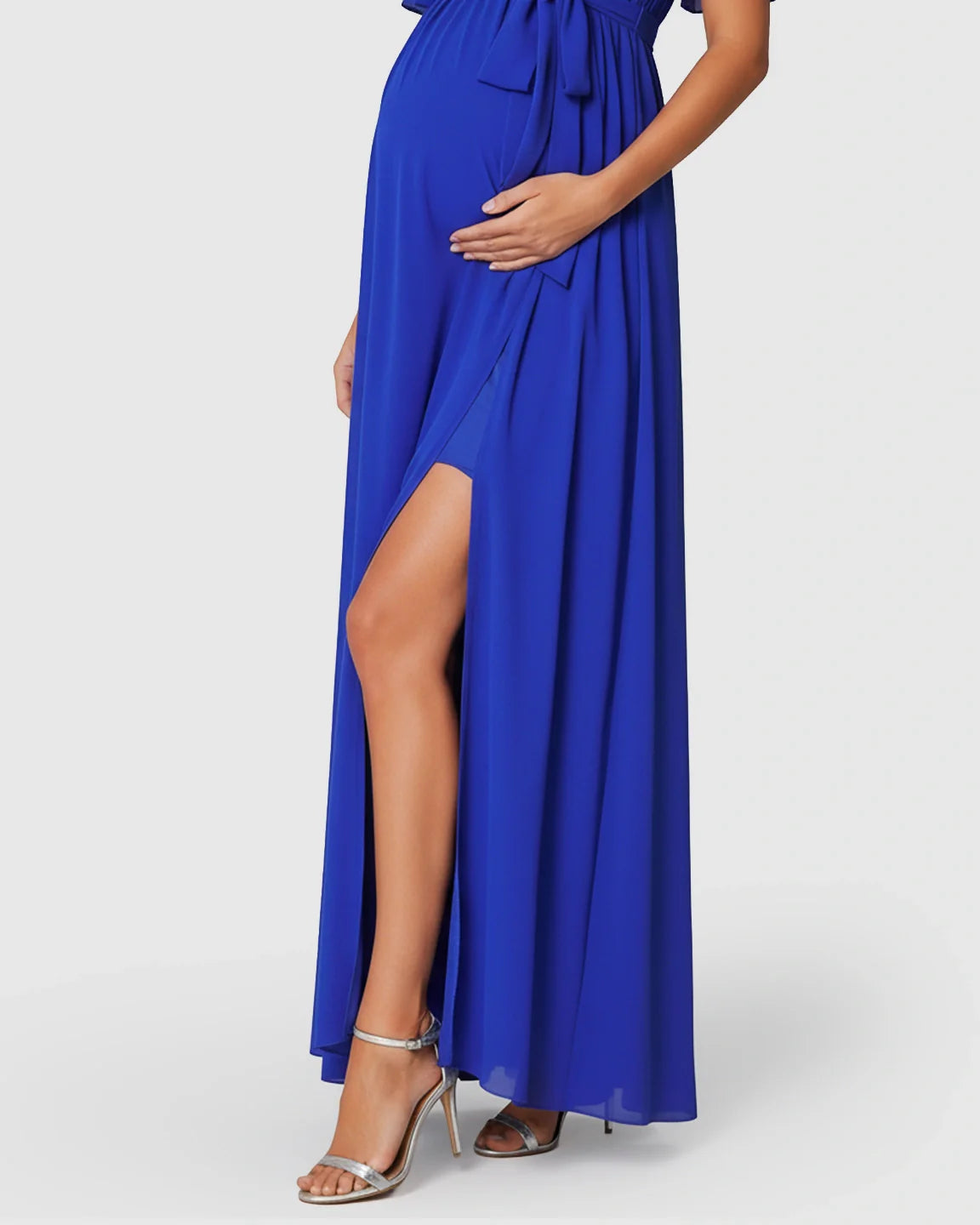 Blue surplice V-neck maternity maxi dress with front slit, flutter sleeves, and empire waist.