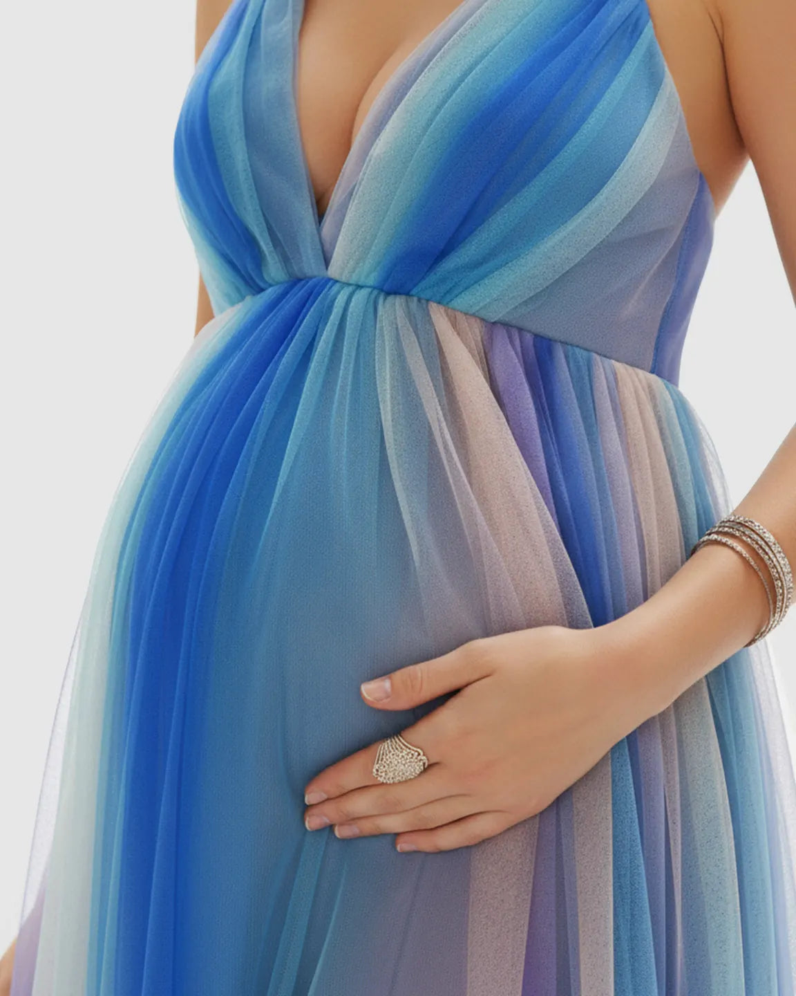 Maternity maxi dress in blue ombre mesh with deep V-neck, spaghetti straps, and empire waist.