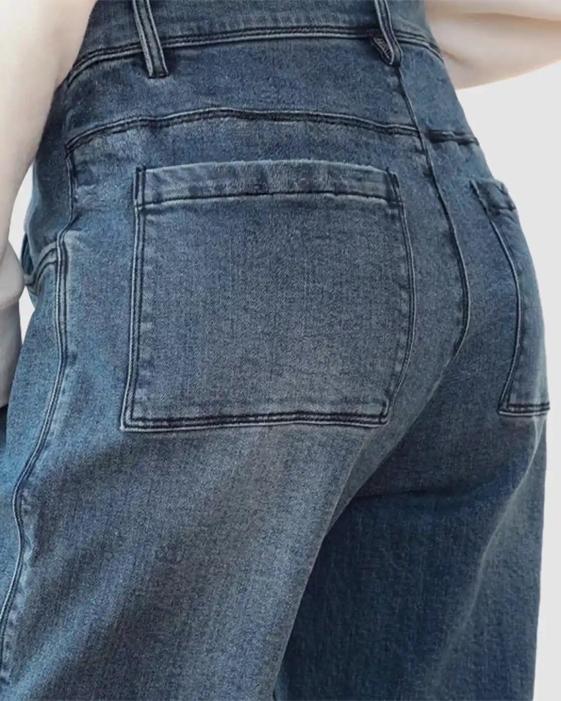 Dark wash wide-leg maternity cargo jeans with large back patch pockets and a comfortable, relaxed fit.