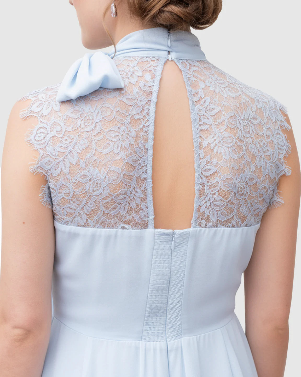 Light blue chiffon maternity midi dress with high-neck tie, lace back, and keyhole detail.