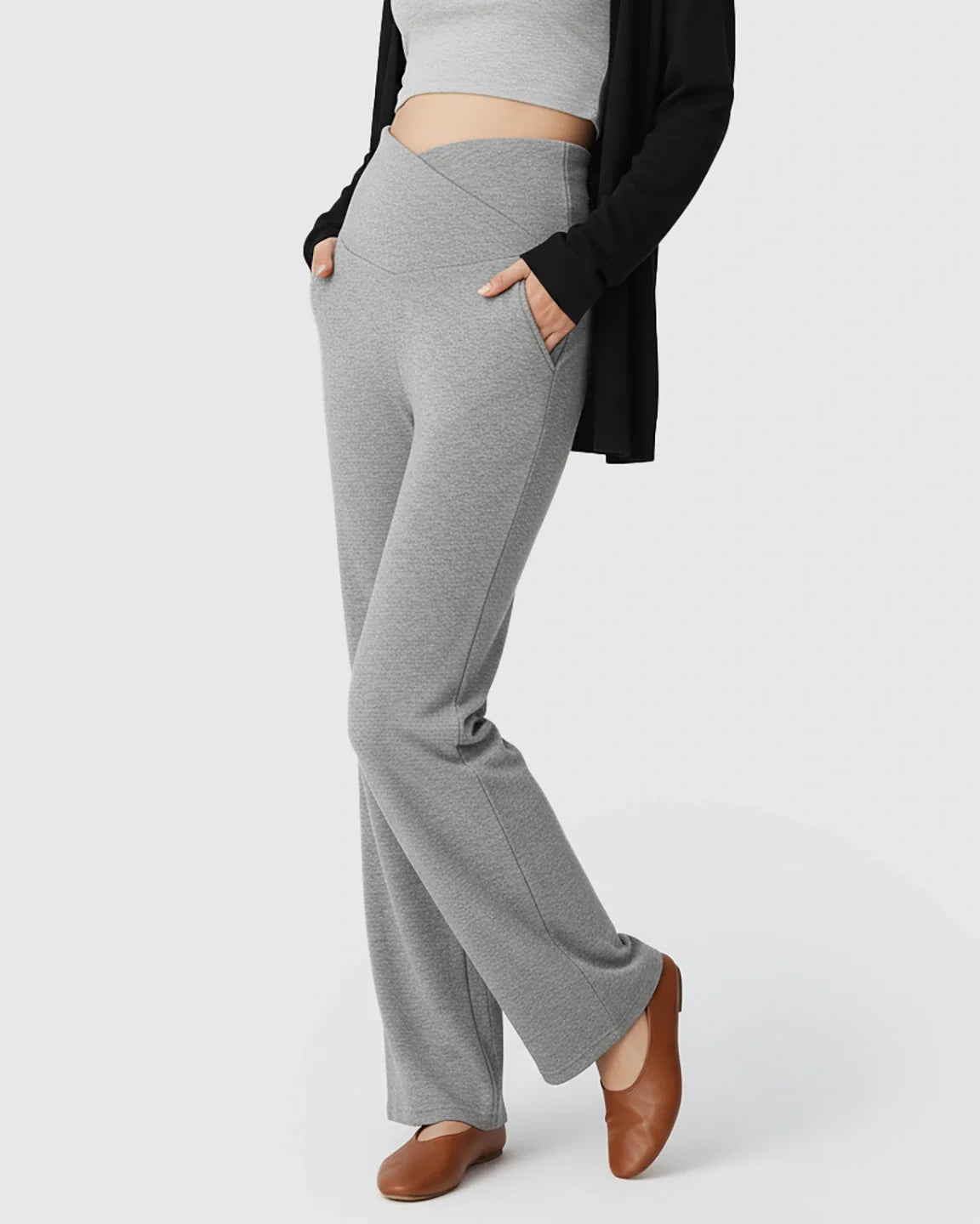 Gray wide-leg maternity lounge pants with a crossover waist, side pockets, and a relaxed fit.