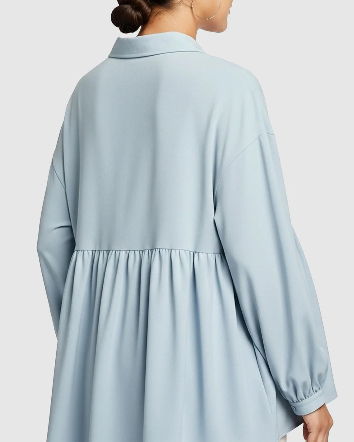 Light blue chiffon maternity shirt with lapel collar, long sleeves, and loose babydoll fit.