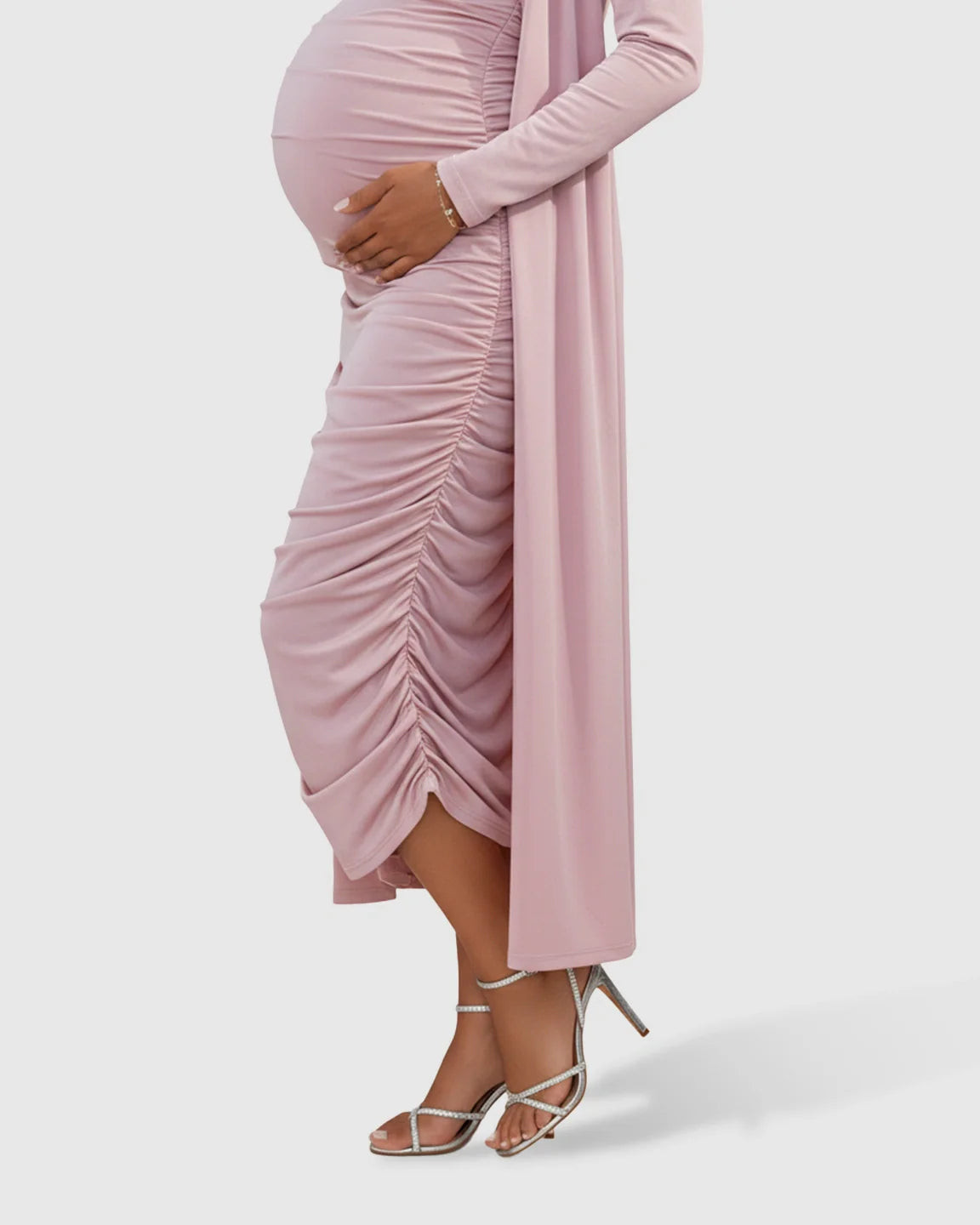 Pink side-ruched maternity slip dress and long-sleeve cardigan set, worn by a pregnant woman.