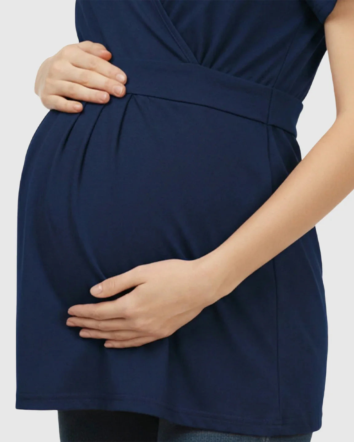 Navy V-neck wrap-style maternity top with adjustable waist tie, shown on a pregnant woman.