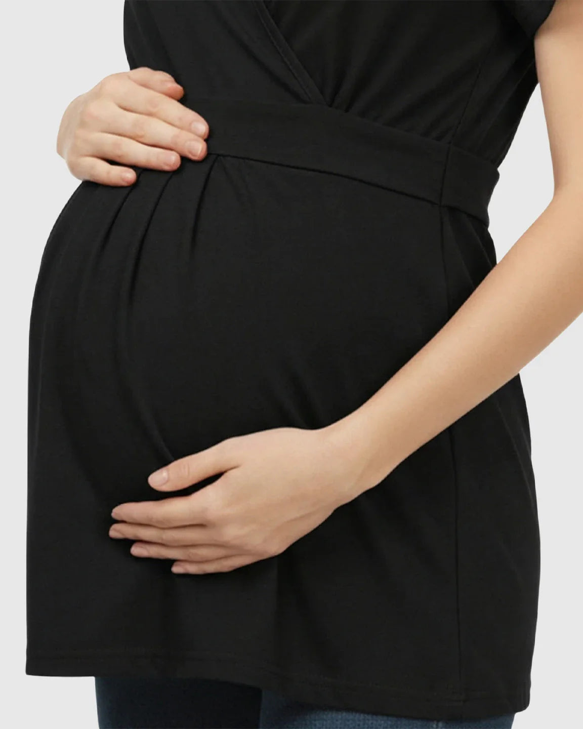 Black V-neck wrap-style maternity top with adjustable waist tie, shown on a pregnant woman.