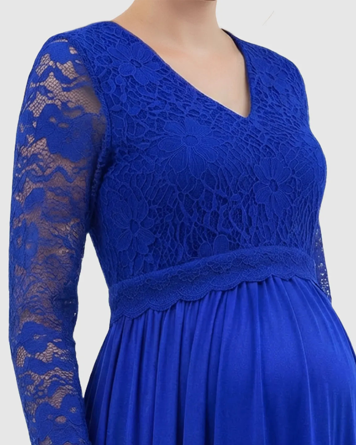 Royal blue maternity maxi dress with lace-spliced bodice, V-neck, long lace sleeves, and flowing skirt.