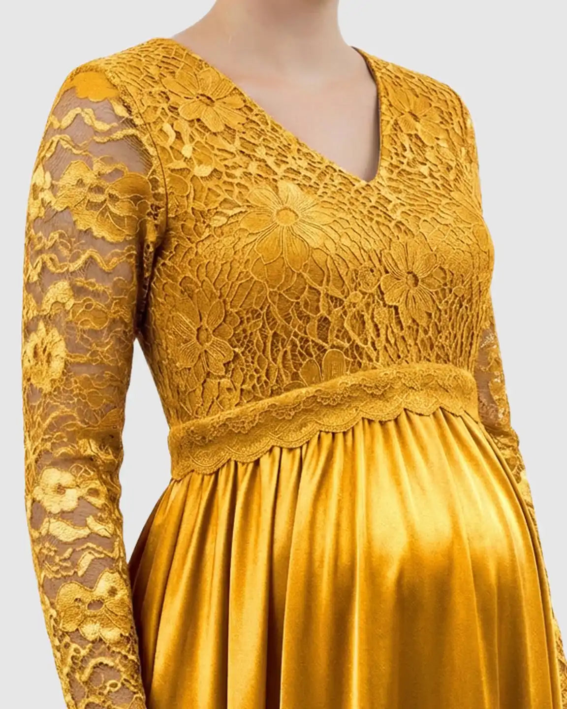 Golden lace-spliced bodice maternity maxi dress with V-neck and flowing skirt.