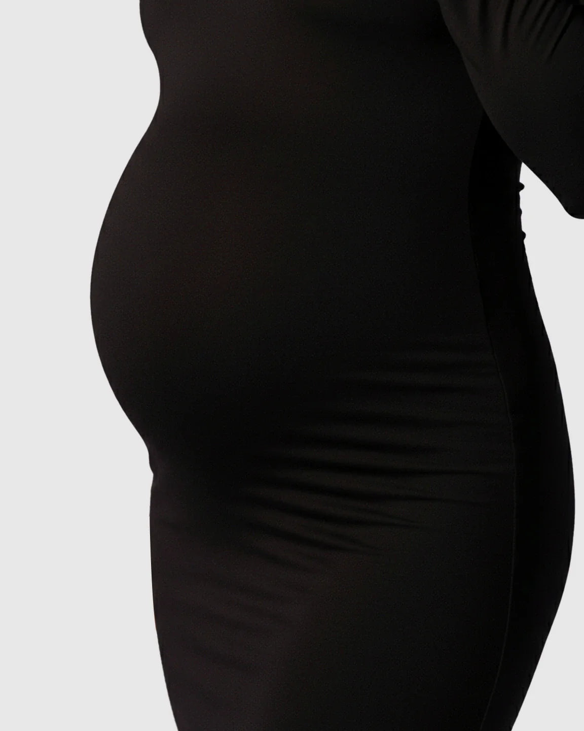 Black mock-neck bodycon maternity maxi dress, showcasing a pregnant belly.
