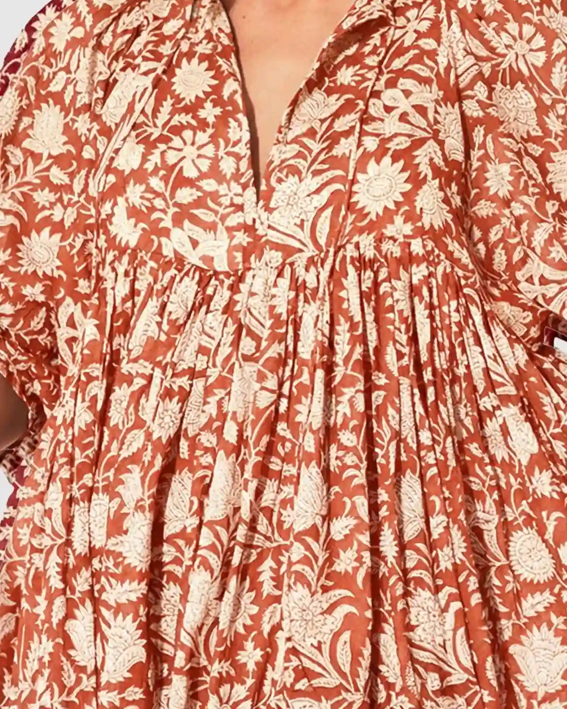 Rust floral loose-fit maternity midi dress with gathered shoulders, puff sleeves, and a V-neck.