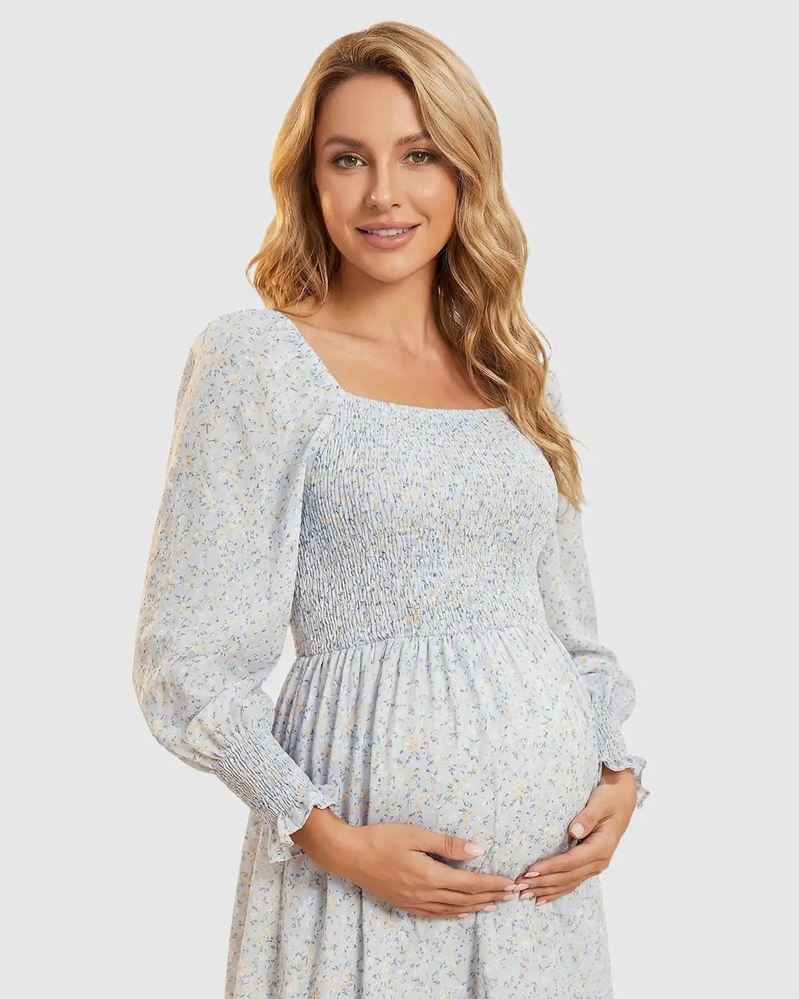 Maternity midi dress: light blue floral print, smocked bodice, long sleeves, square neckline.