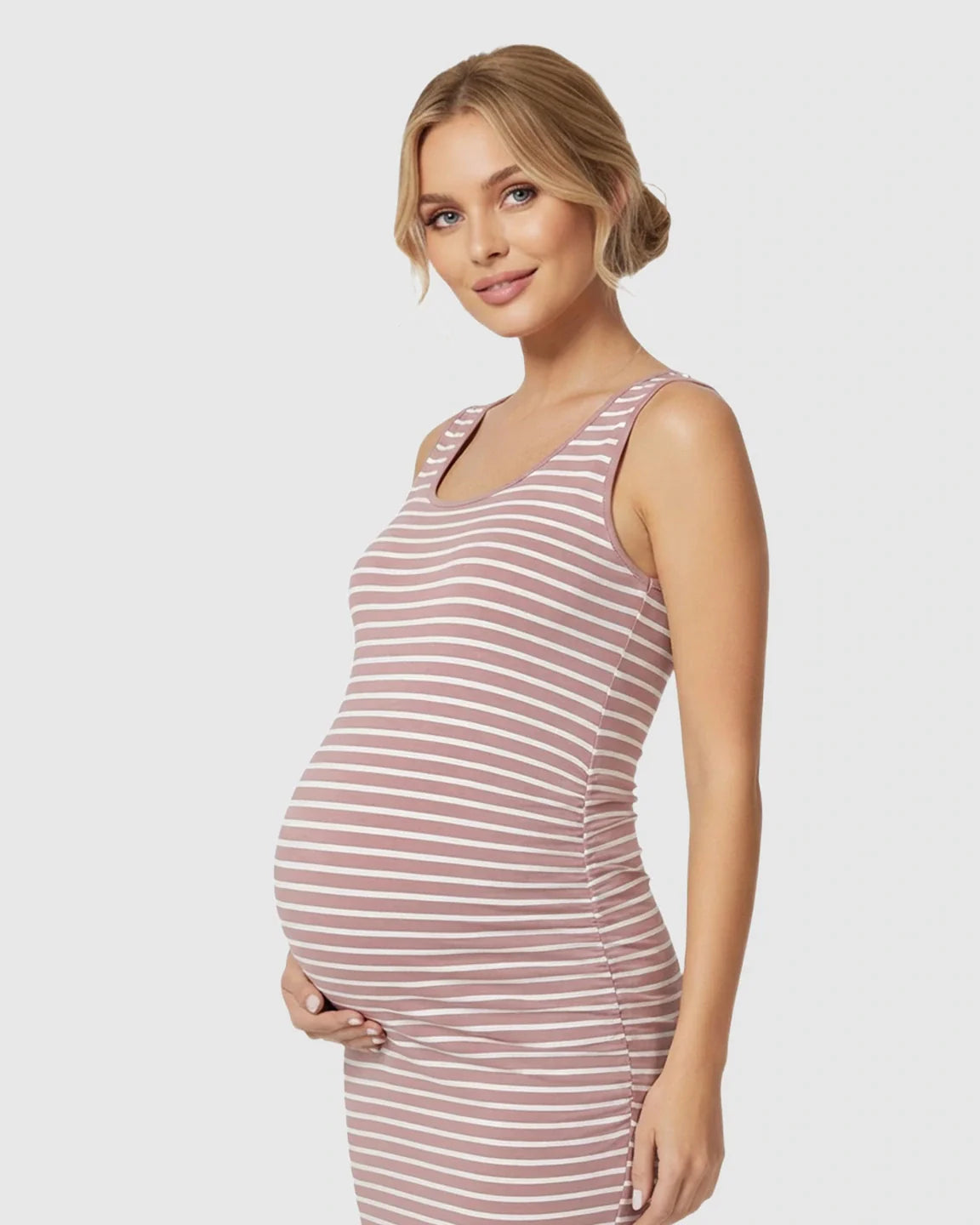 Maternity model in a pink and white striped sleeveless bodycon dress with side pleats.